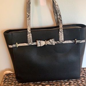 Charming Charlie black leather tote with metal and snakeskin print accents.